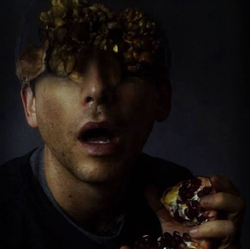 Portrait of Verlon with pomegranates